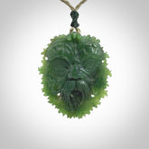 This picture shows a large hand carved forest man face pendant. The cord is hand plaited and adjustable.