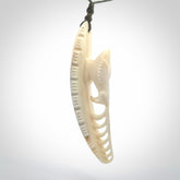 This is a hand carved bone contemporary warthog tusk pendant. Yuri Terenyi has carved this from warthog tusk. It is a delightful, large and artistic piece of jewellery. One only necklace.