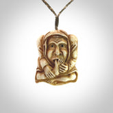 Hand carved incredible stained bone gargoyle face carving. A stunning work of art. This pendant was hand carved in bone with buffalo horn inlay for the eyes by Yuri Terenyi. A one off collectors item that has been hand crafted to be worn or displayed.