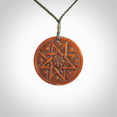 Hand carved natural stained bone contemporary disc pendant with creative and unique carvings on the front face of each individual piece.