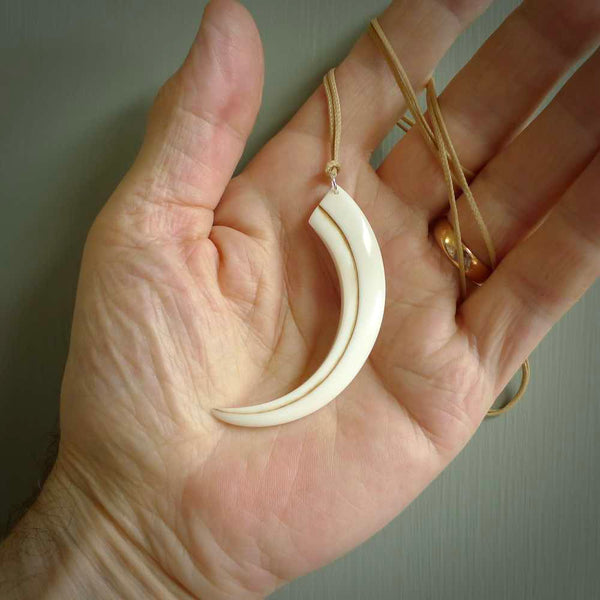 Hand carved incredible Huia bird beak bone carving. A stunning work of art, beautifully replicating a hula bird beak. This pendant was hand carved in bone by artist Sami. A one off collectors item that has been hand crafted to be worn or displayed.