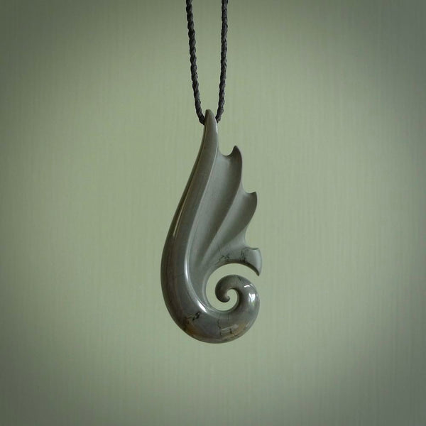 Hand made large New Zealand Argillite Koru pendant. Hand carved in New Zealand by Kerry Thompson. Hand made jewellery. Unique large Argillite Stone Koru with adjustable cord. Free shipping worldwide.