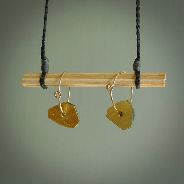 These earrings are beautifully hand made with gorgeous flair. They are fashionable and perfect for a women with style. Hand carved from a gorgeous piece of New Zealand Marsden jade with Gold leaf and gold plated hoops - they are elegant and beautiful.