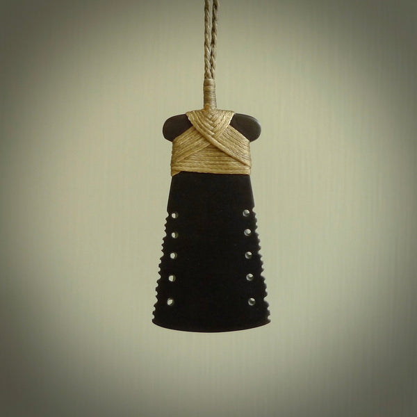 Black Jade toki pendant in all its lovely glory. We've used a lovely piece of Australian Black Jade for this traditional toki pendant. The sides are notched and we've bound it with a hand plaited cord in the traditional style. On sale by NZ Pacific with free delivery worldwide.