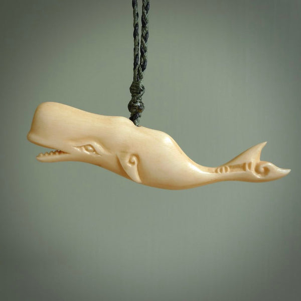 Hand carved whale pendant, carved by us. This piece is carved from cow bone and is a fantastic depiction of these giants of the deep. This particular piece is a humpback whale design and is lovingly carved. New Zealand made whale pendant from bone.