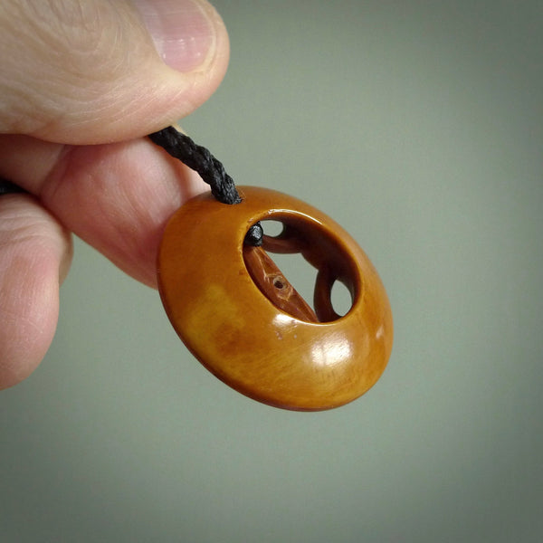 These are two hand carved Japanese design pendants. Yuri Terenyi has carved this from Bone and stained them with his homemade dye. They are delightful, medium sized and artistic pieces of jewellery. One only necklace.