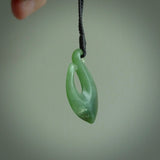New Zealand jade hei-mate pendant. Hand carved in bright green jade by Ric Moor. The pendant is suspended from  black plaited cord and is finished in a satin matte polish.