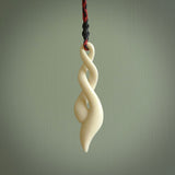 A handcarved masterpiece. A complex twist pendant carved from bone by Yuri Terenyi for NZ Pacific. This is a true piece of wearable art which is collectible. A one-off masterpiece and quite unique.