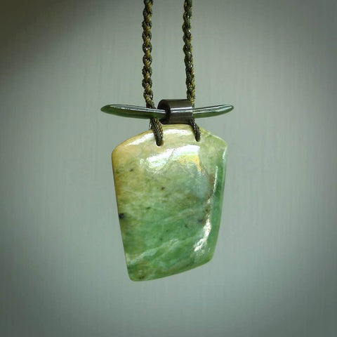 Hand carved New Zealand Jade pendant with adjustable cord. This piece is a stand out work of creativity and skill and we love Jen Hung's creations. Unique, one only, New Zealand made necklace for sale. Free shipping worldwide.