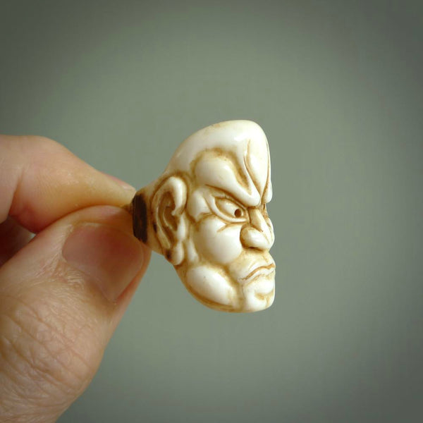 Hand carved Ni-Oh mask ring. Made from Red Deer antler in New Zealand. Unique Ni-Oh Mask ring hand made from deer antler by master bone carver Fumio Noguchi. Spectacular collectable work of art, made to wear. One only ring, delivered to you at no extra cost with express courier.