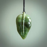Hand carved New Zealand Jade leaf pendant with adjustable cord. This piece is a stand out work of creativity and skill and we love Raegan Bregmen's creations. Unique, one only, New Zealand made necklace for sale. Free shipping worldwide.
