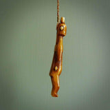 POKERFACE - a traditional Gambier Island figurine, carved as a pendant. This piece was hand carved for us by Yuri Terenyi. This is a work of art and is a collectable piece of traditional bone carving. It can be worn as a special piece of jewellery or displayed. This is art made to wear at its finest.