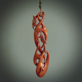 A one off beautiful piece of carved art. We have called this Twin Flame, it was hand carved for us by Yuri Terenyi and is a double manaia pendant. This is a wonderful ethnic bone pendant designed to be worn. It has been stained by a homemade tea dye in a bright gingery brown colour and we have hand plaited an adjustable cord in Khaki and gingernut brown colours..