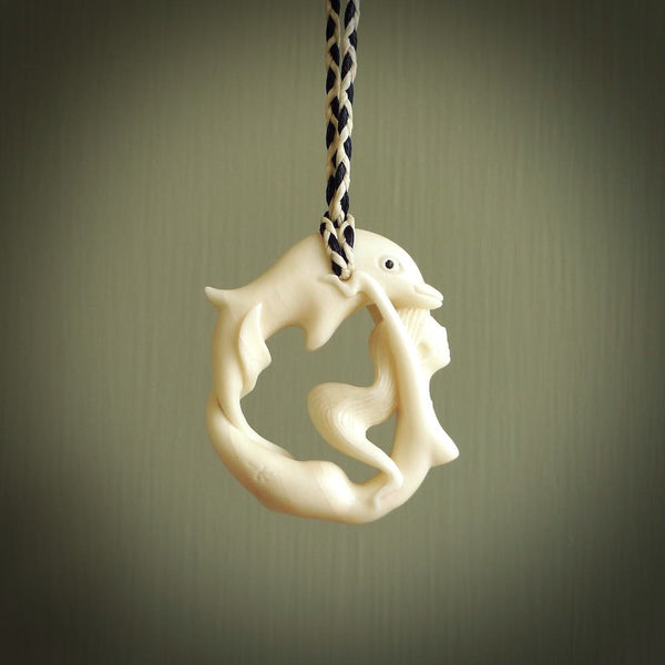 This pendant is a gorgeous and intricately carved mermaid with dolphin pendant. Carved by renowned bone carver Yuri Terenyi for us. This is a little masterpiece. It is a mermaid with her arms clasped around a dolphin. The craftsmanship displayed in this piece is extraordinary - a collectors item, or a piece to wear and love.