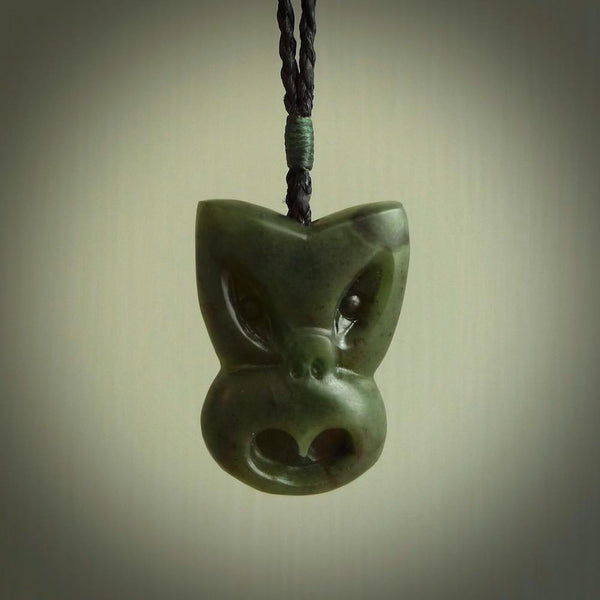 Hand carved New Zealand Jade Pounamu Wheku face pendant. Carved from New Zealand Jade by NZ Pacific. Hand crafted Jade jewellery for sale online. Pacific carving pendant, striking and unique delivered to you with Express Courier at no extra cost.