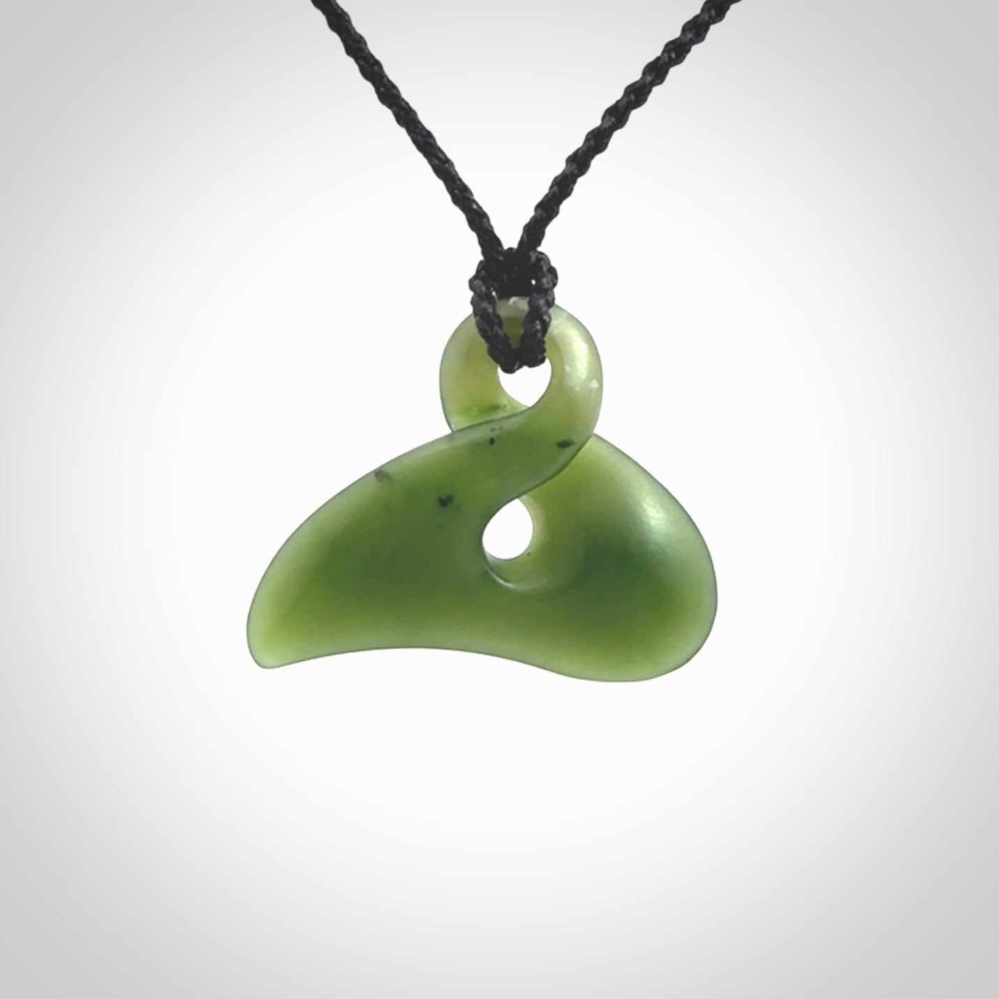 Hand carved smaller sized, New Zealand jade twist pendant. Carved in New Zealand by NZ Pacific.