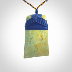 Hand carved Toki pendant from a lovely piece of local New Zealand Flower Jade. We have suspended this from a 4-plait beige cord which can be adjusted with a couple of slip knots and beige binding.