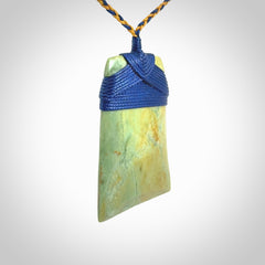 Hand carved Toki pendant from a lovely piece of local New Zealand Flower Jade. We have suspended this from a 4-plait beige cord which can be adjusted with a couple of slip knots and beige binding.