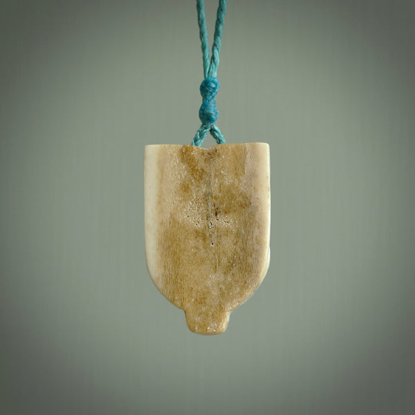 Hand carved Wheku pendant. Carved from deer antler by NZ Pacific. Hand crafted bone jewellery for sale online.