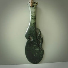 Hand carved wahaika Pounamu. Art to display. One only hand made wahaika display piece with base. New Zealand wahaika carved in Pounamu, Jade by Kerry Thompson. Free delivery worldwide.