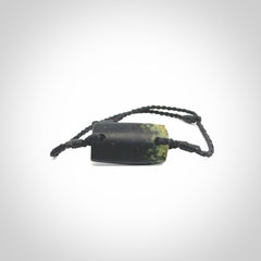 Hand carved New Zealand jade adjustable bracelet with black cord. Carved in New Zealand jade by Ric Moor for NZ Pacific. One only armband for women and men.