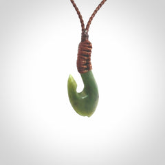 Small New Zealand jade hei-matau, hook, pendant.