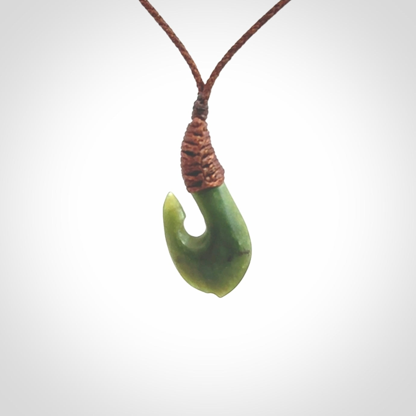 Small New Zealand jade hei-matau, hook, pendant.