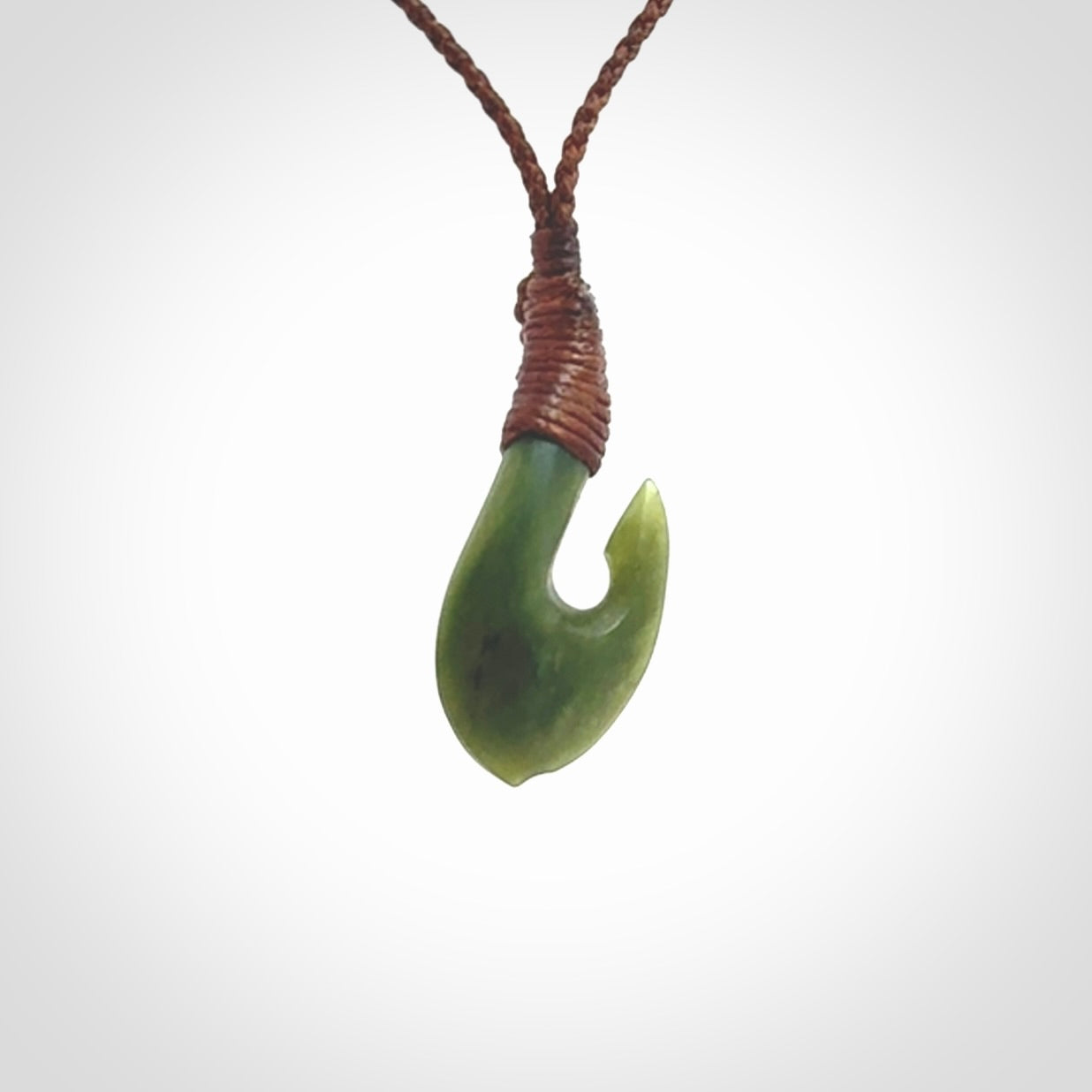 Small New Zealand jade hei-matau, hook, pendant.