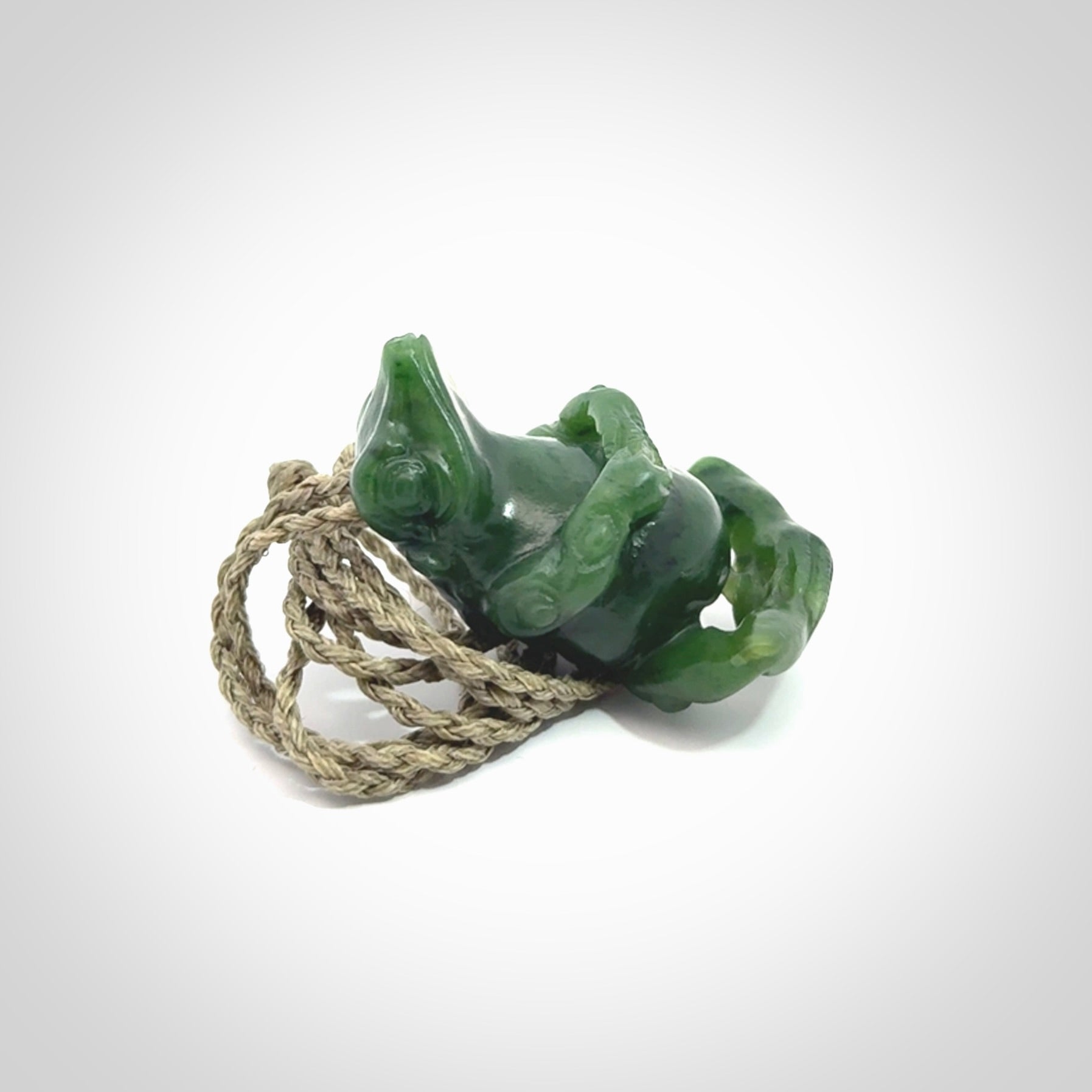 Hand carved frog pendant. Carved in British Columbian jade by NZ Pacific.