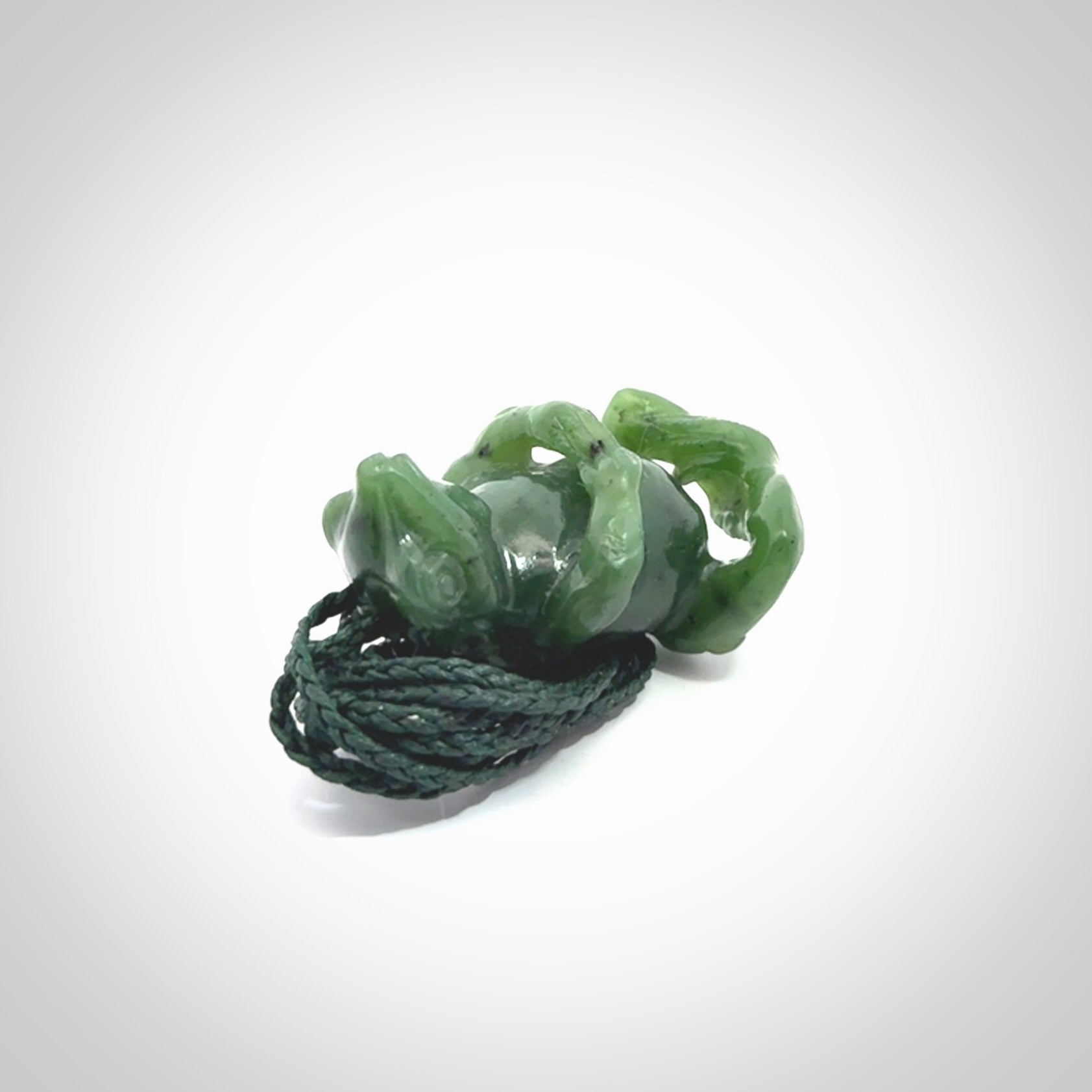 Hand carved frog pendant. Carved in British Columbian jade by NZ Pacific.
