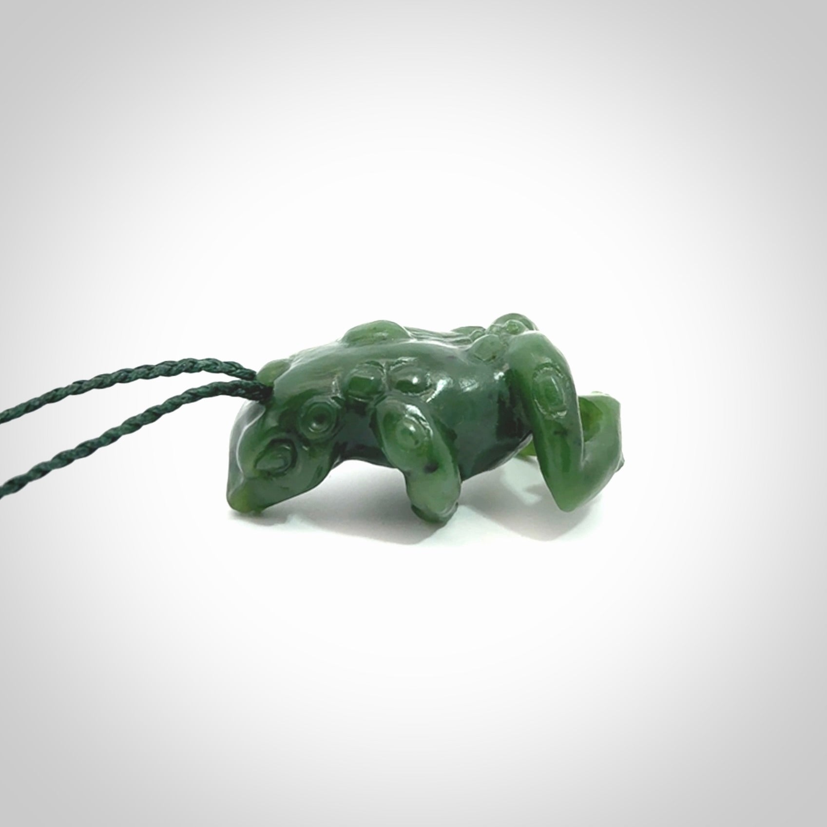 Hand carved frog pendant. Carved in British Columbian jade by NZ Pacific.