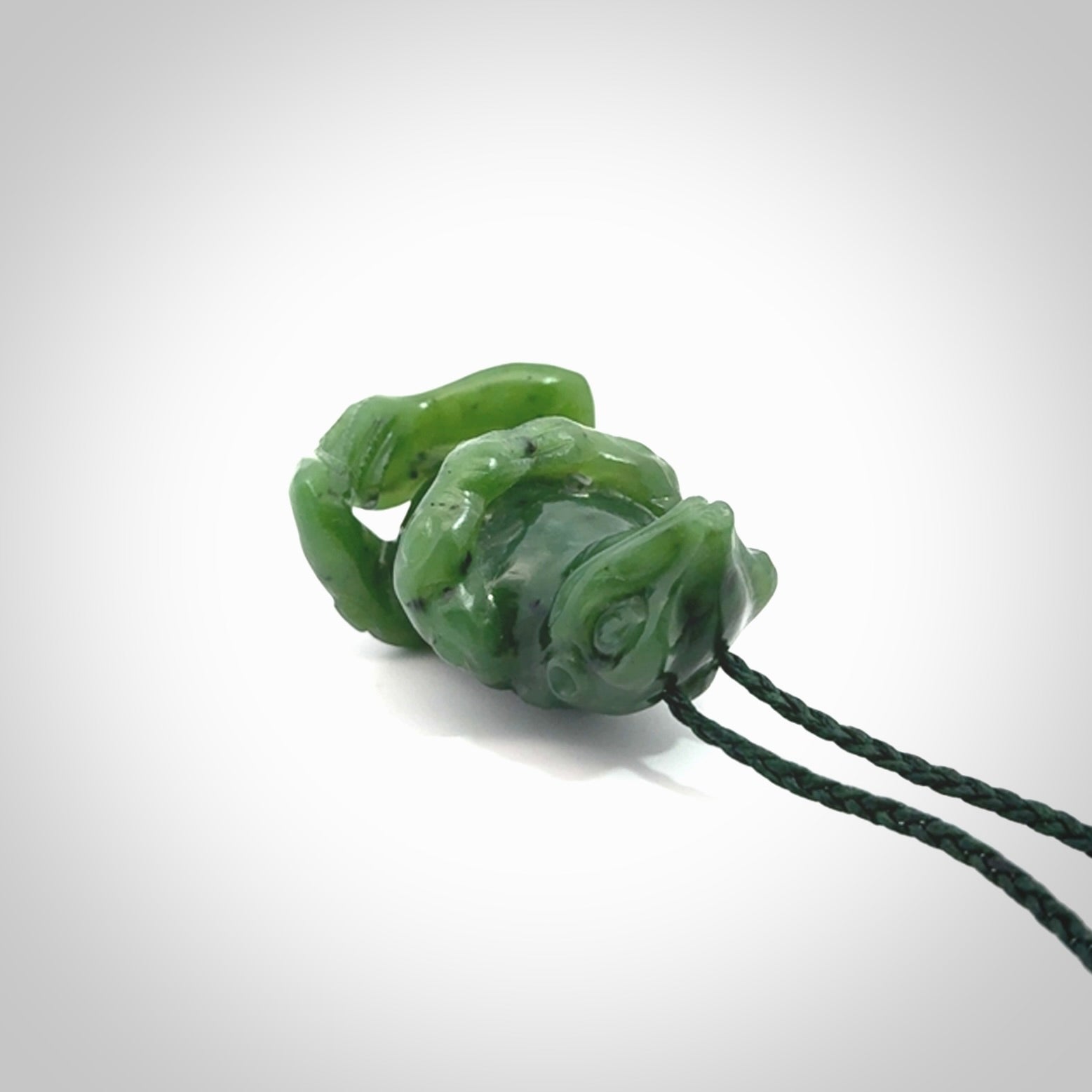 Hand carved frog pendant. Carved in British Columbian jade by NZ Pacific.