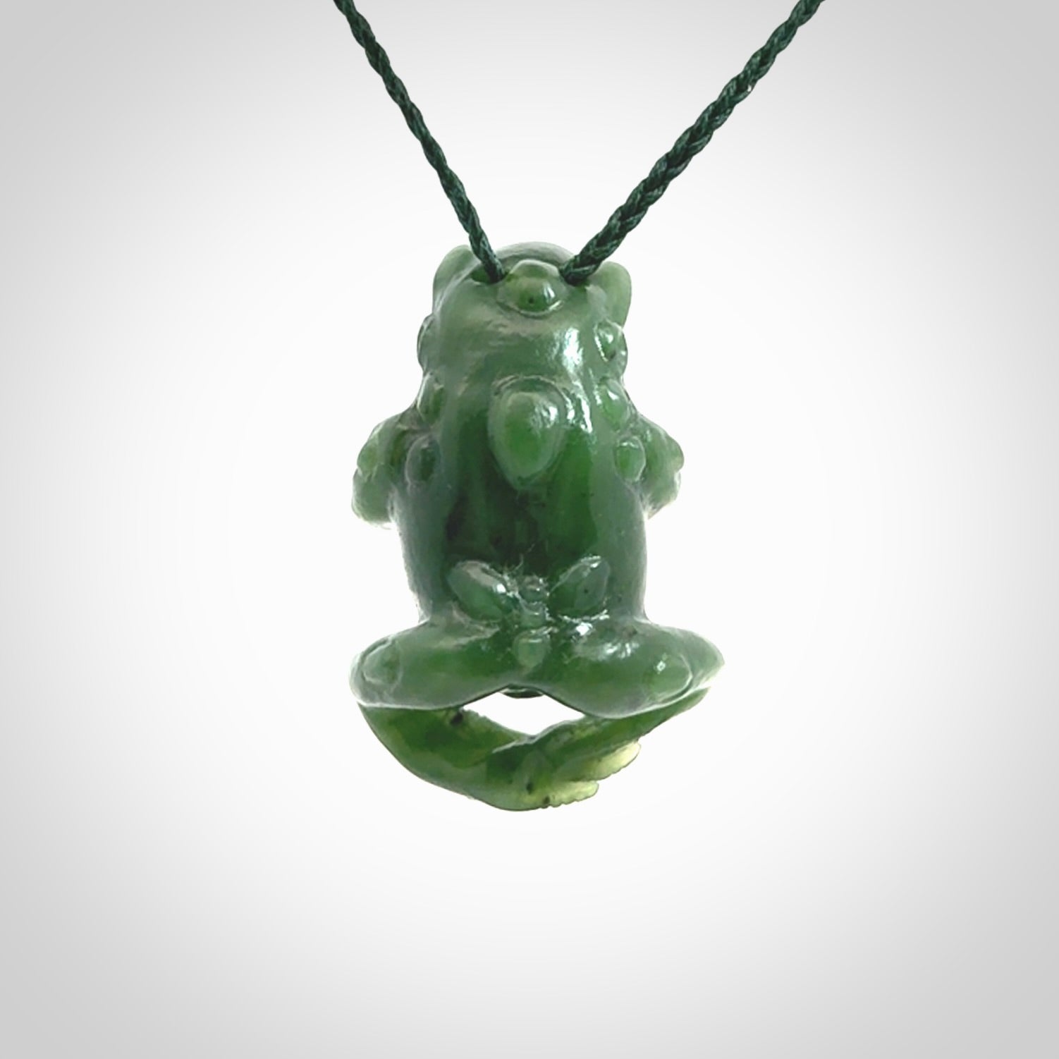 Hand carved frog pendant. Carved in British Columbian jade by NZ Pacific.