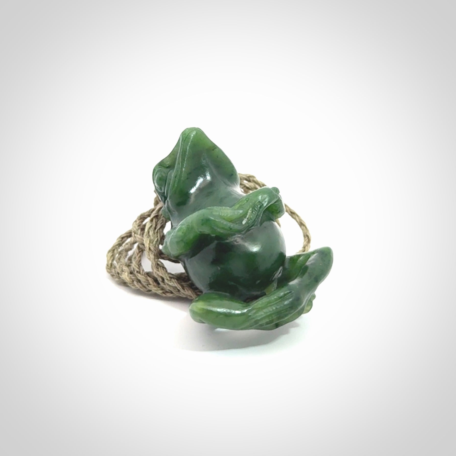 Hand carved frog pendant. Carved in British Columbian jade by NZ Pacific.