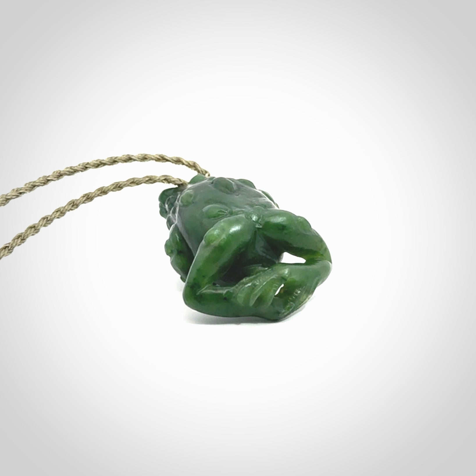 Hand carved frog pendant. Carved in British Columbian jade by NZ Pacific.