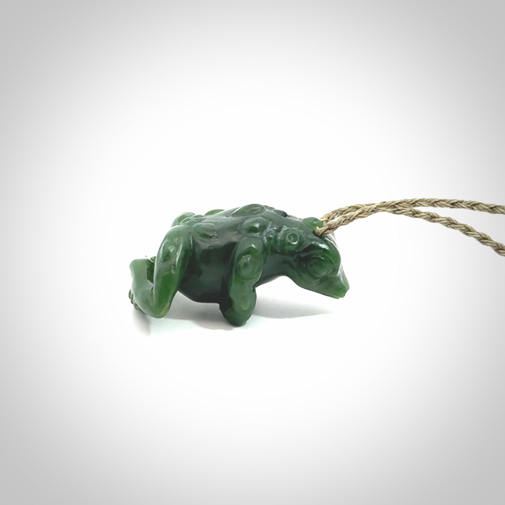 Hand carved frog pendant. Carved in British Columbian jade by NZ Pacific.