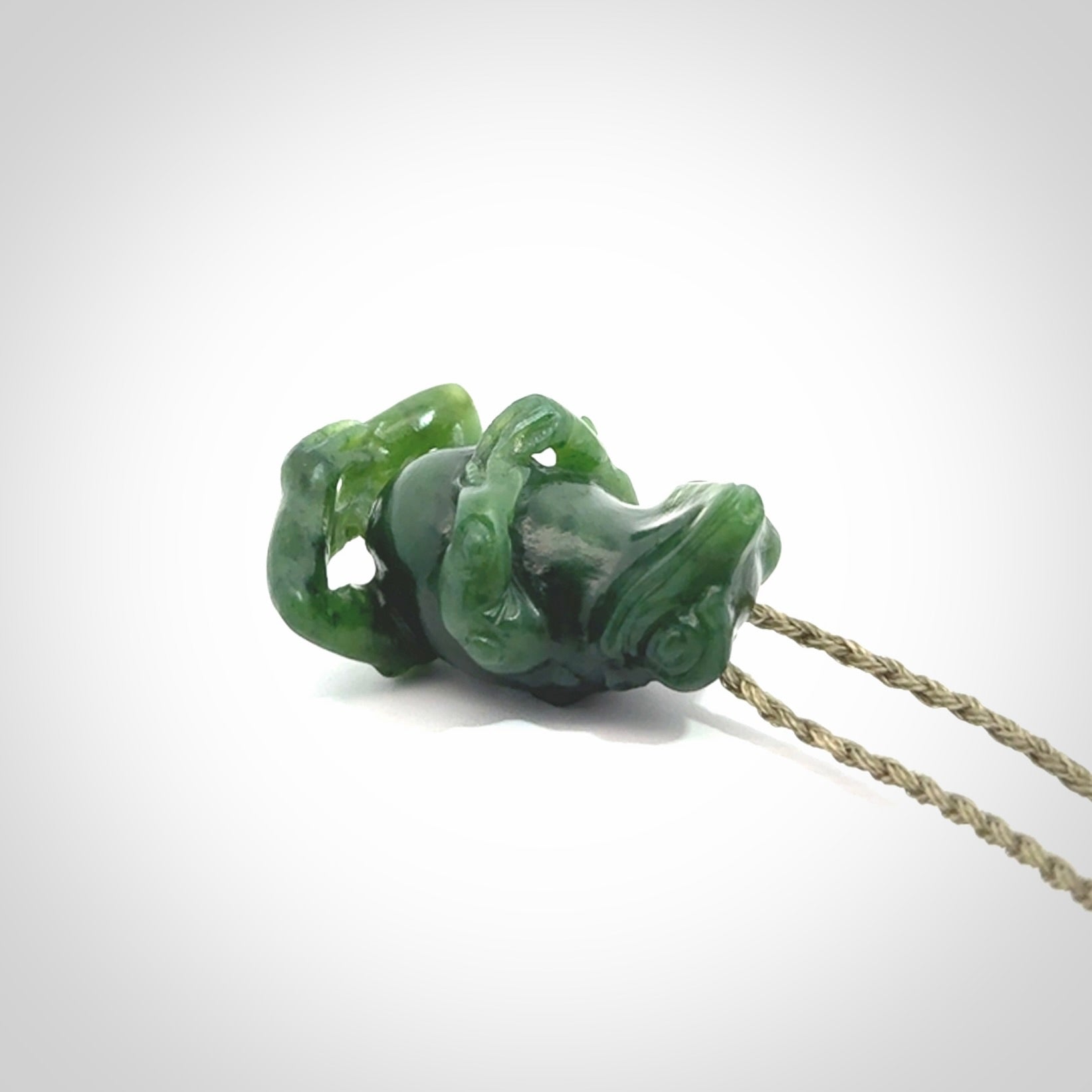 Hand carved frog pendant. Carved in British Columbian jade by NZ Pacific.