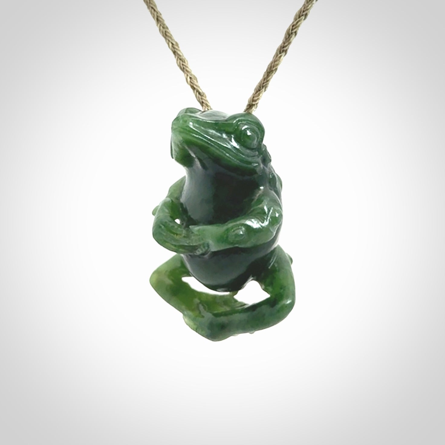 Hand carved frog pendant. Carved in British Columbian jade by NZ Pacific.