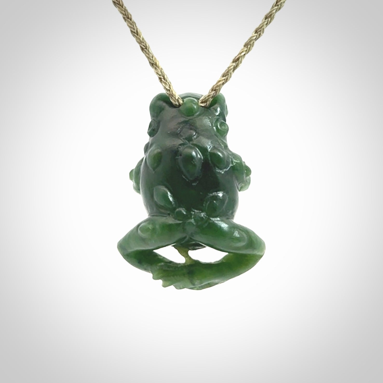 Hand carved frog pendant. Carved in British Columbian jade by NZ Pacific.