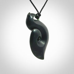 A hand carved New Zealand Jade contemporary koru pendant.