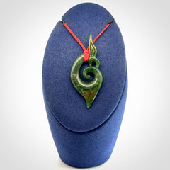 A Finely-Carved Manaia Koru Pendant