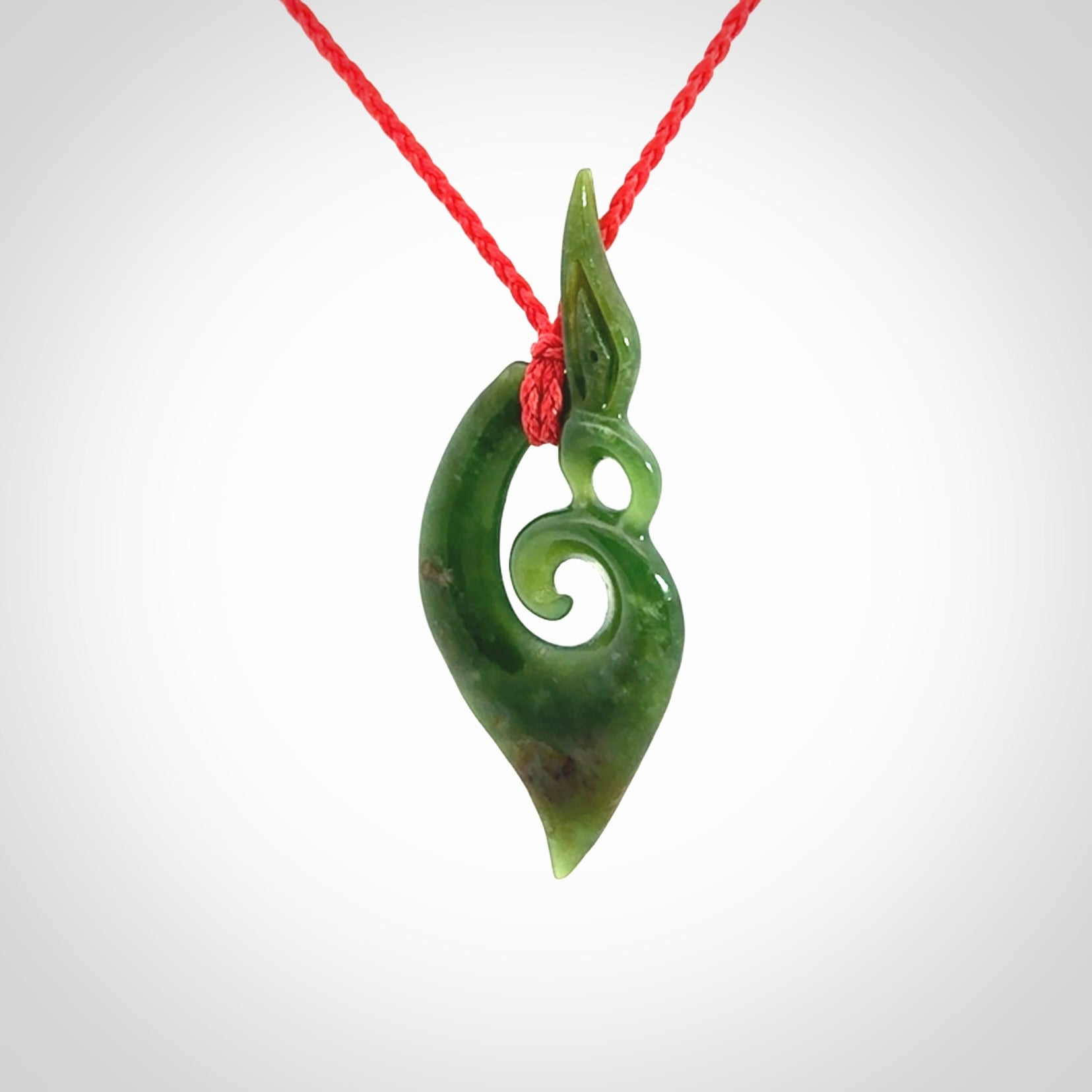 A Finely-Carved Manaia Koru Pendant