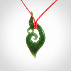 A Finely-Carved Manaia Koru Pendant