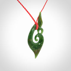 A Finely-Carved Manaia Koru Pendant