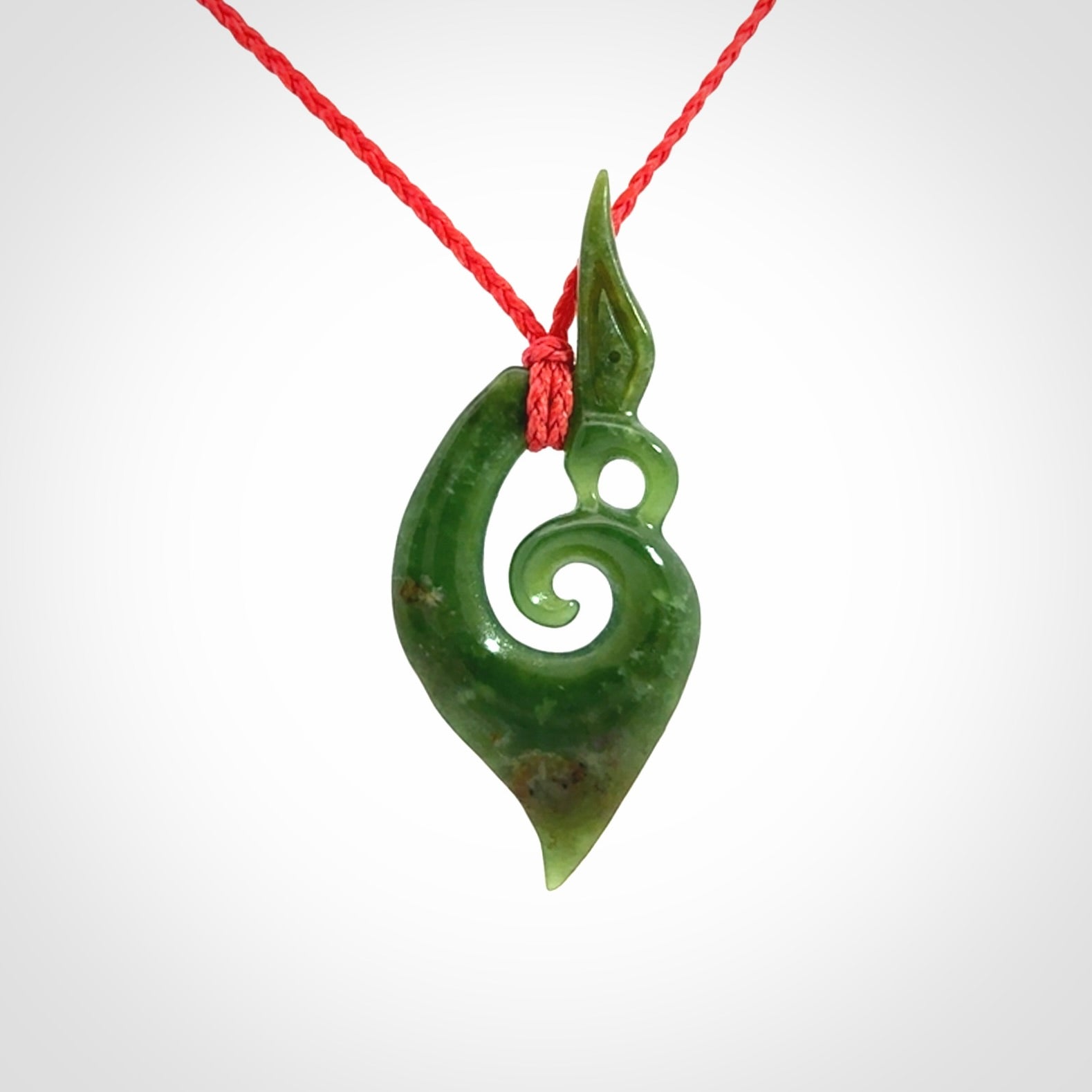 A Finely-Carved Manaia Koru Pendant