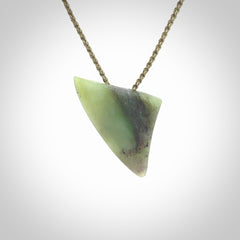 This is a lovely New Zealand Jade, pounamu niho drop pendant. It is bound with an adjustable khaki coloured cord which is length adjustable.