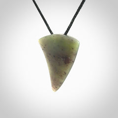 This is a lovely New Zealand Jade, pounamu niho drop pendant. It is bound with an adjustable black coloured cord which is length adjustable.