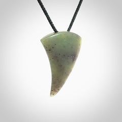This is a lovely New Zealand Jade, pounamu niho drop pendant. It is bound with an adjustable black coloured cord which is length adjustable.