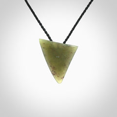 This is a lovely New Zealand Jade, pounamu niho drop pendant. It is bound with an adjustable black coloured cord which is length adjustable.