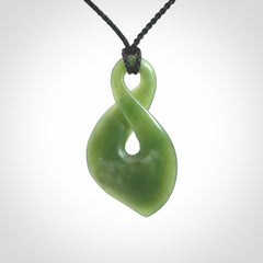 This piece is a fine, delicate drop shaped, single twist pendant. It was carved for us by Ric Moor from a lovely deep green piece of New Zealand jade. It is suspended on an black four plaited braided cord that is length adjustable.